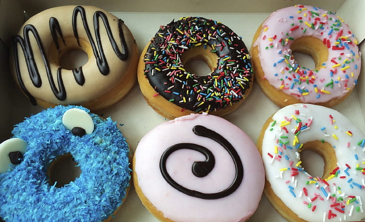 six assorted-color frosted doughnuts