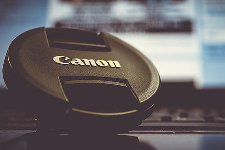 Camera lens cap on desk