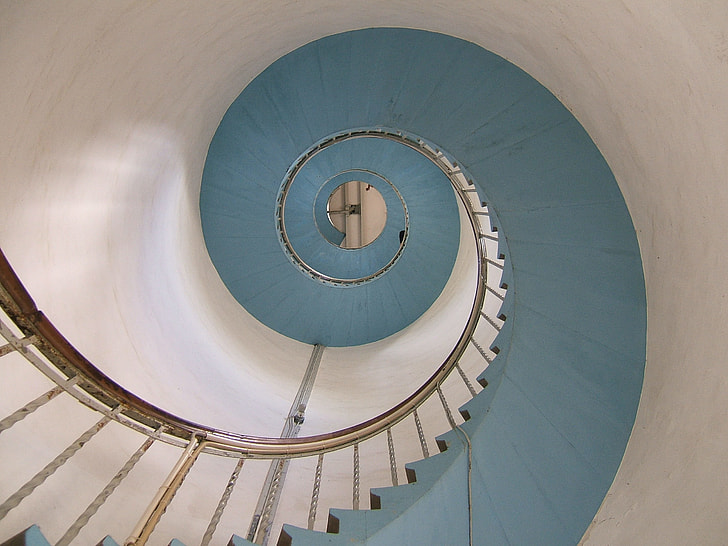 low angle photography of spiral stairway