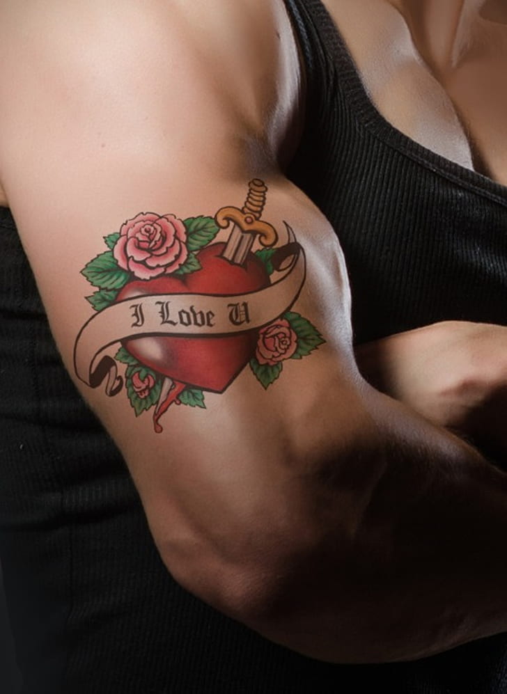 man's forearm with i Love U tattoo