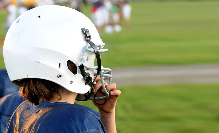 person wearing white NFL helmet