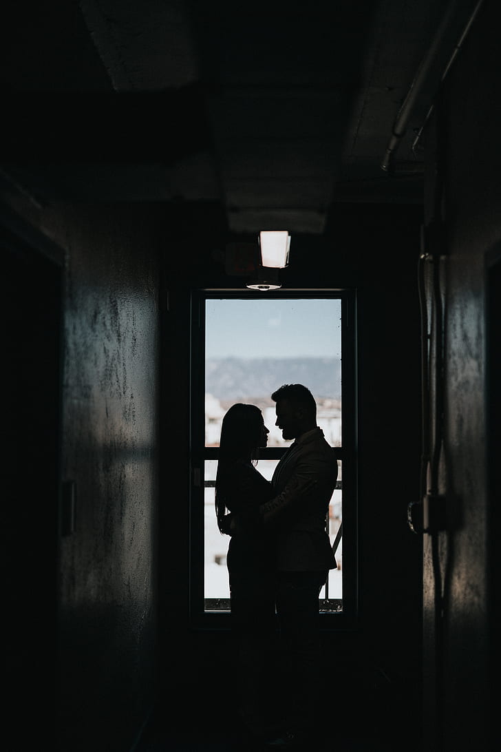silhouette photography of couple hugging