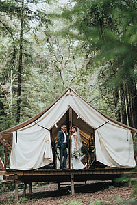 bride and groom in canopy tent