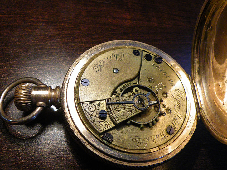 open silver pocket watch