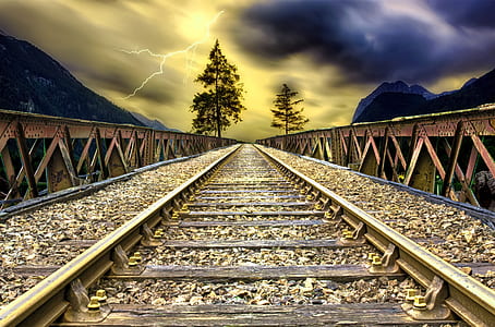 photography of gray train rails