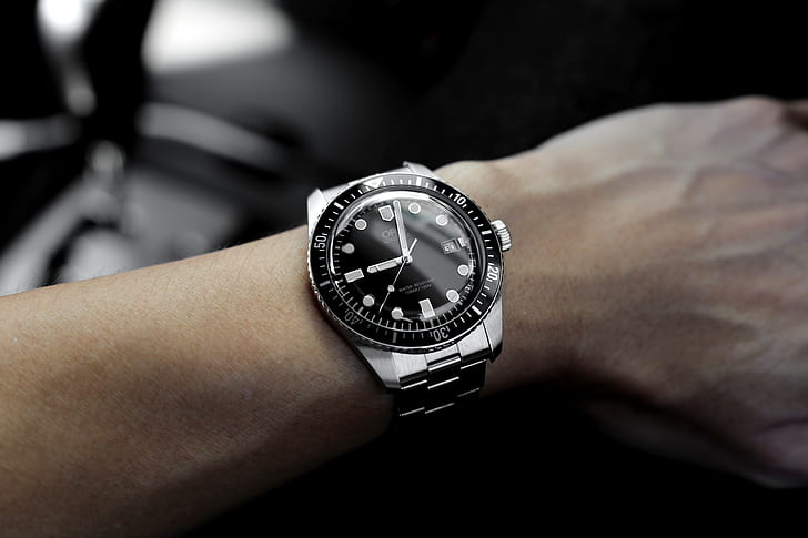 round black and silver-colored analog watch with link straps at 9:02