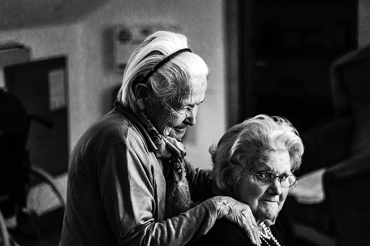two old woman grayscale photography