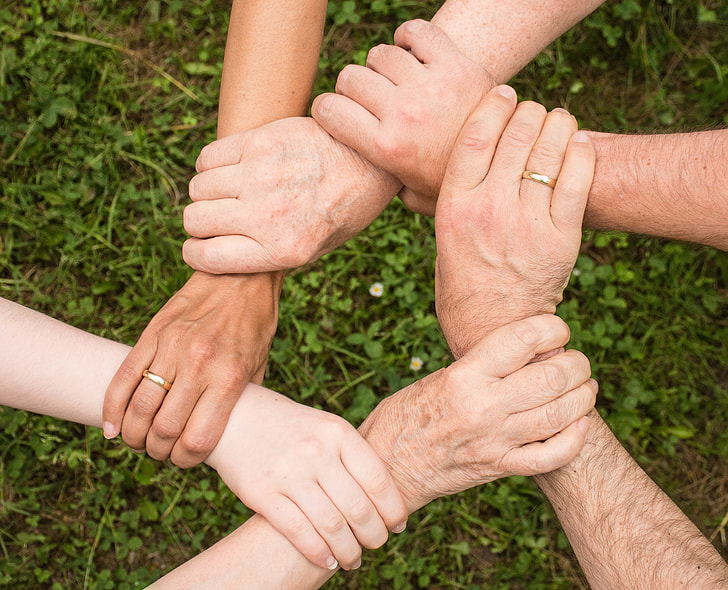 five person holding hands