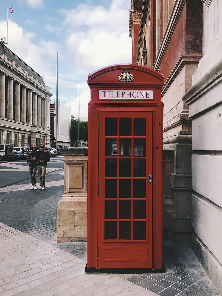photography of red telephone booth