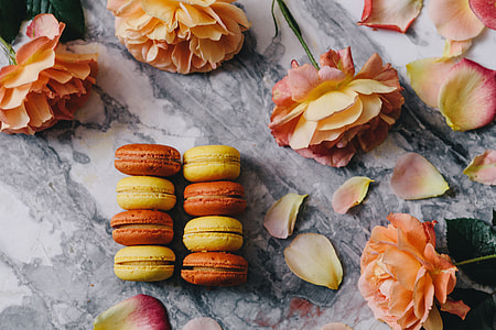 Overhead view of macarons on a marble slab