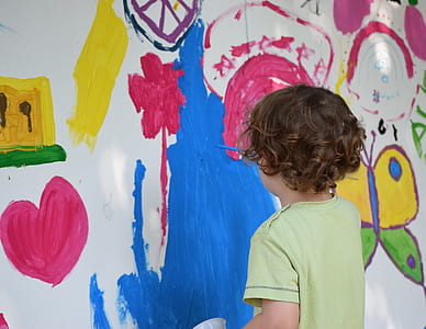 child painting on wall