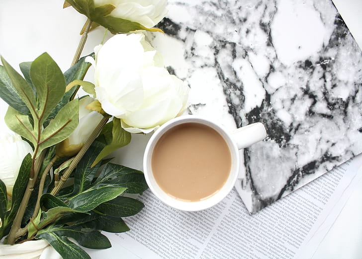 white peony flowers beside cup of coffee