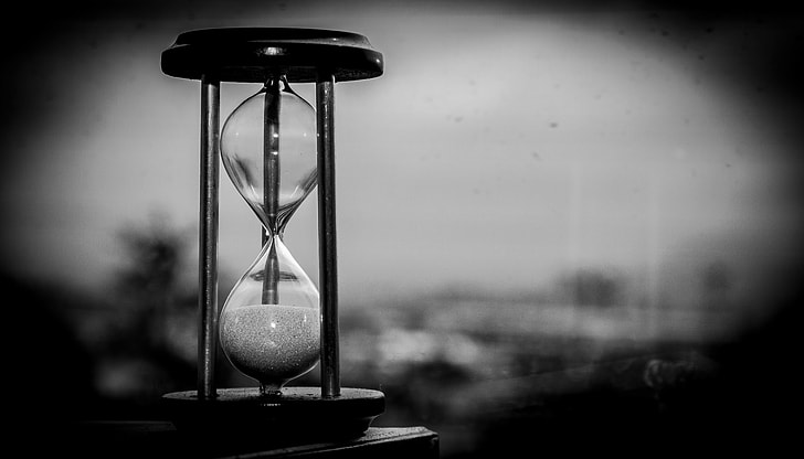 hourglass grayscale photo