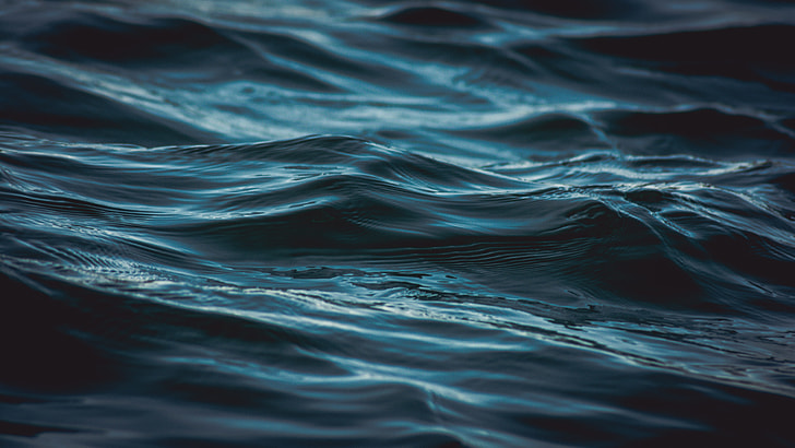 shallow focus photography of body of water waves