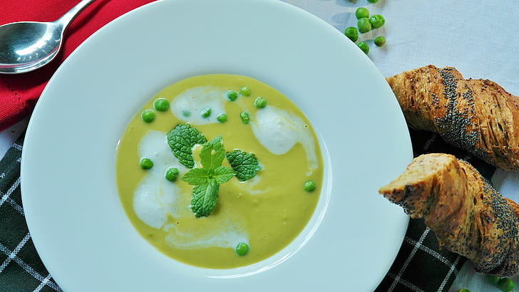 yellow and green cream soup on white plate