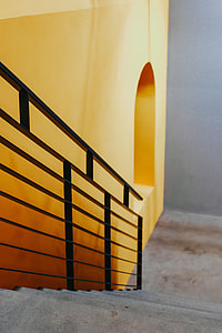Staircase by a yellow wall
