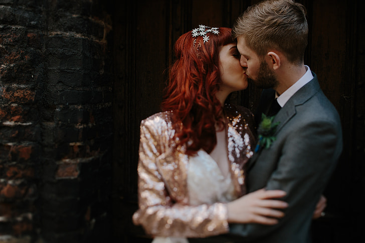 selective focus photography of couple kissing