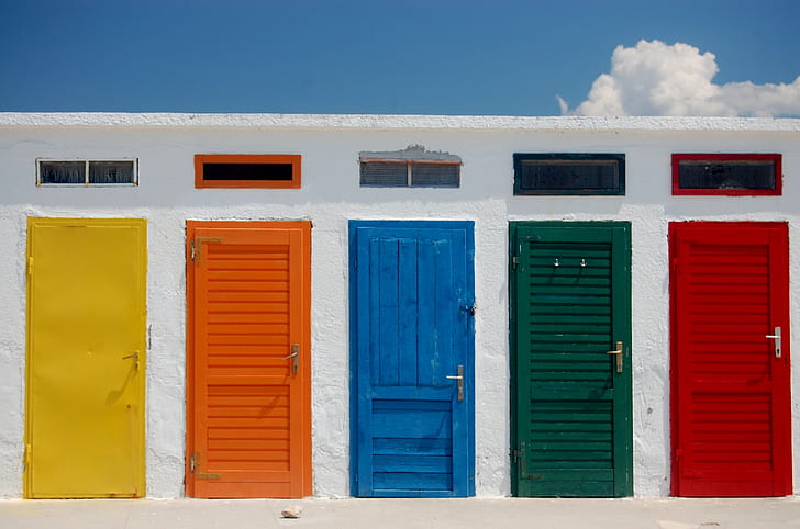 yellow, orange, blue, green, and red wooden doors