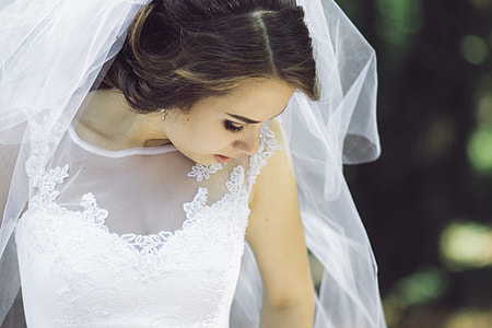 woman wearing white wedding gown
