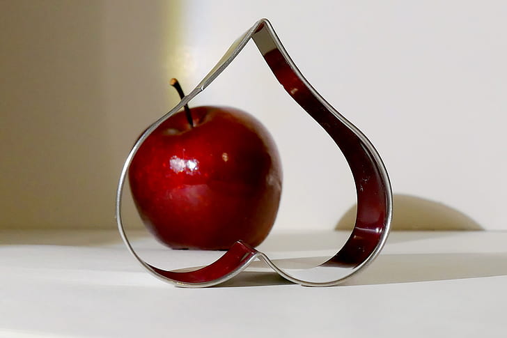 stainless steel heart frame near apple decor