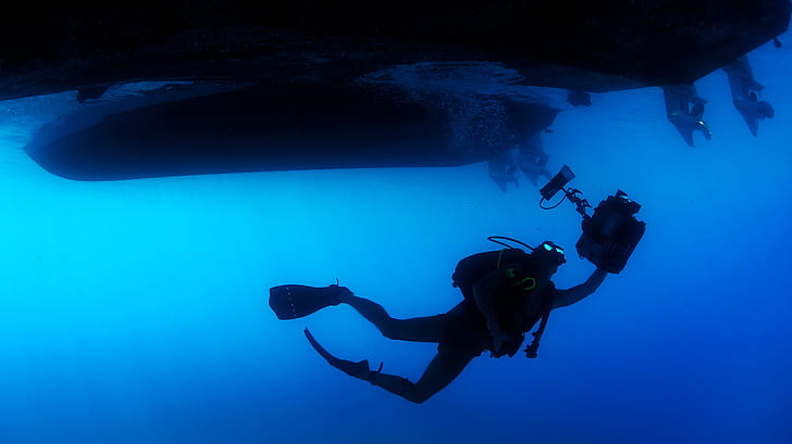 man in diving equipment underwater