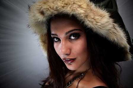 woman wearing black and beige furred hat