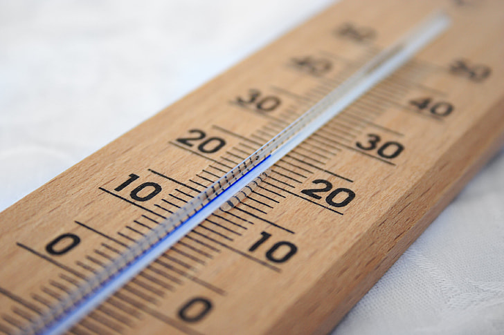brown wooden thermometer