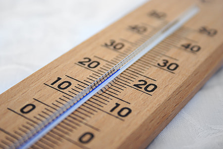 brown wooden thermometer