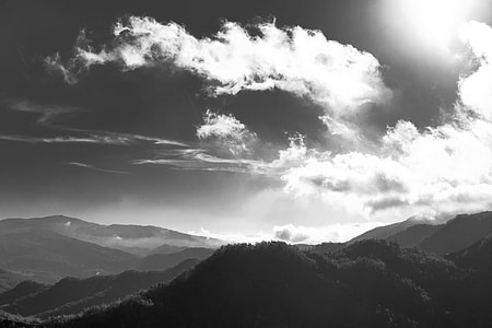 grey scale photo of mountains during daytime