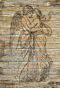 man and woman kissing printed on board