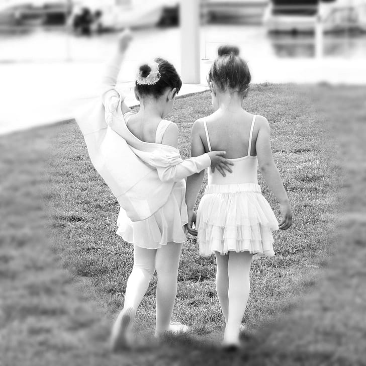 two girl's wearing sleeveless dresses photo
