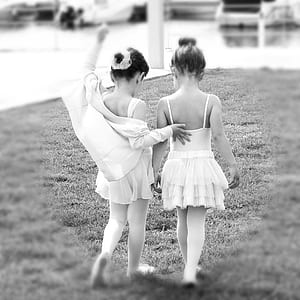 two girl's wearing sleeveless dresses photo