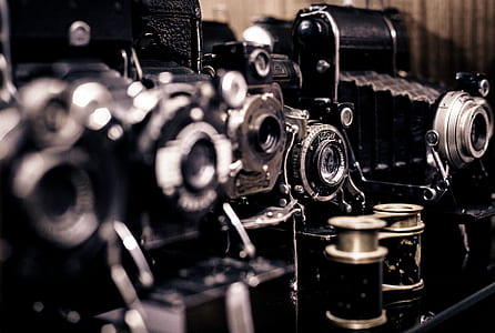 shallow focus photography of vintage cameras