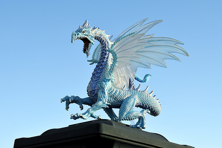 blue dragon statue under blue sky