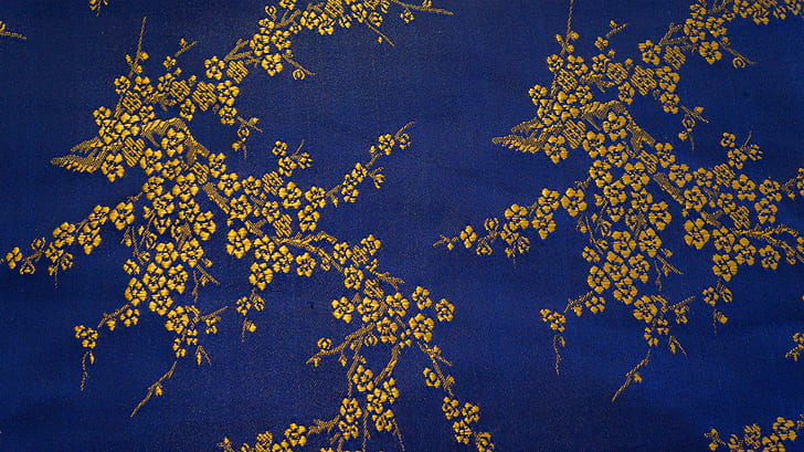 blue and brown floral textile