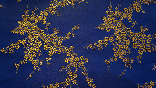 blue and brown floral textile
