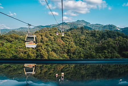 cable car near body of water
