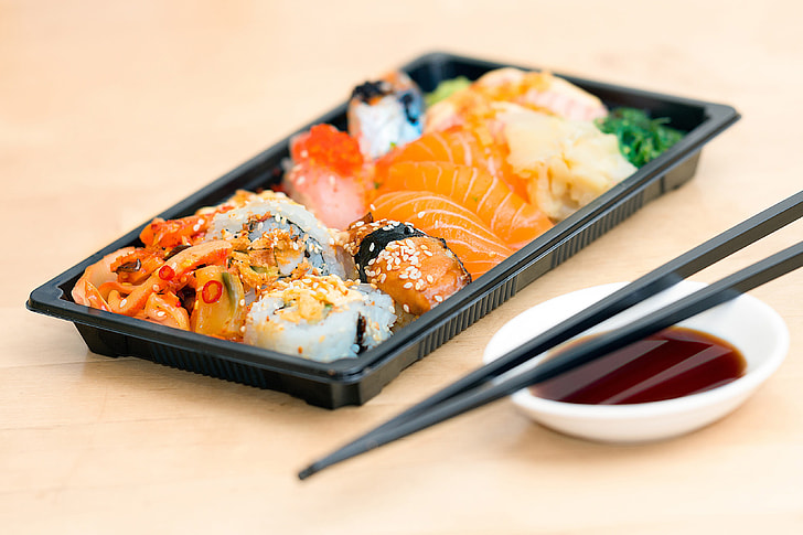 Closeup shot of sushi fish and chopsticks