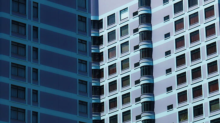 optical illusion photograpy of two blue high-rise buildings