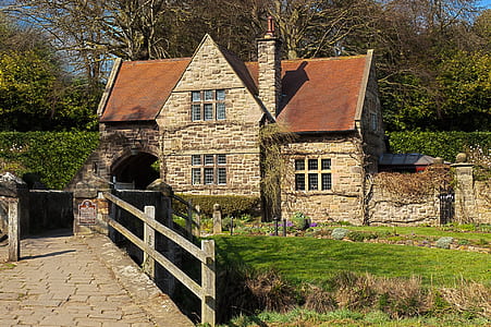 brown brick house in front of bridge