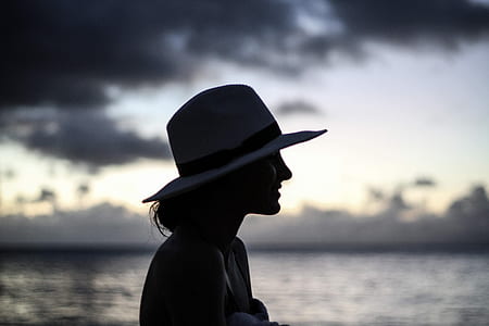 photo of woman wearing sun hat