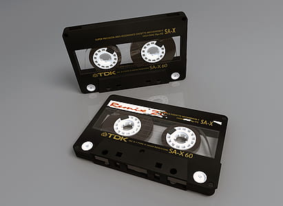 two black TDK compact cassettes