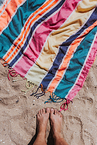 Colorful beach towel on the sand