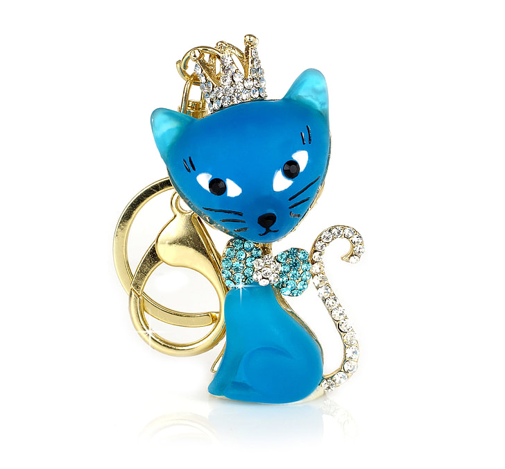 gold-colored and blue cat pendant