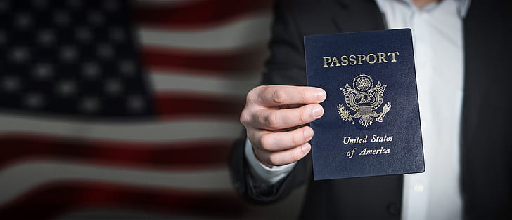 person holding passport of United States of America