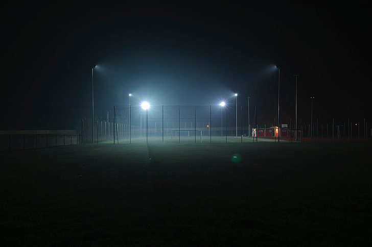 Football field with four lights on the court