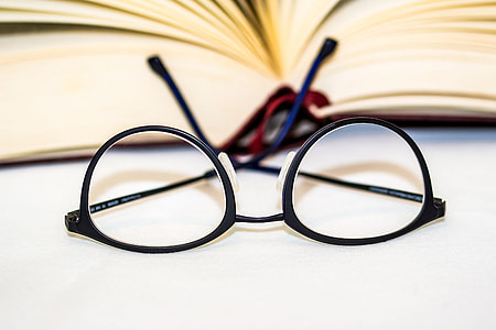 Reading glasses and book