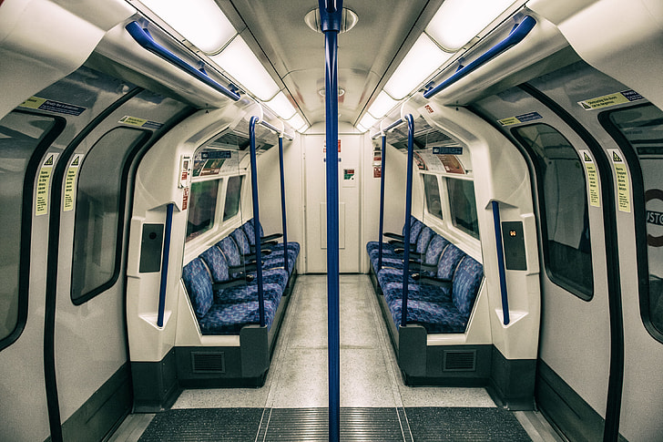 Wide-angle shot of the interior of a train on the London Underground