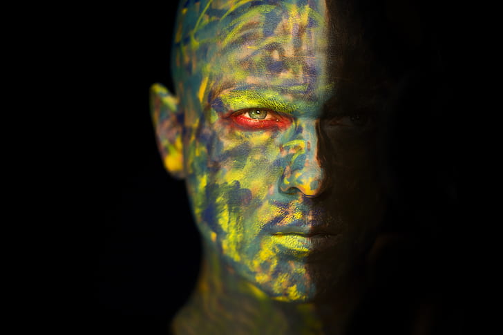 man's face full of paints