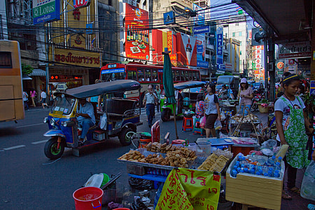 Urban photo of the busy streets of the Chinatown district of Bangkok in Thailand